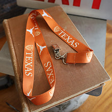 Load image into Gallery viewer, 24&quot; Orange Lanyard imprinted with white University of Texas logo and Longhorn silhouette
